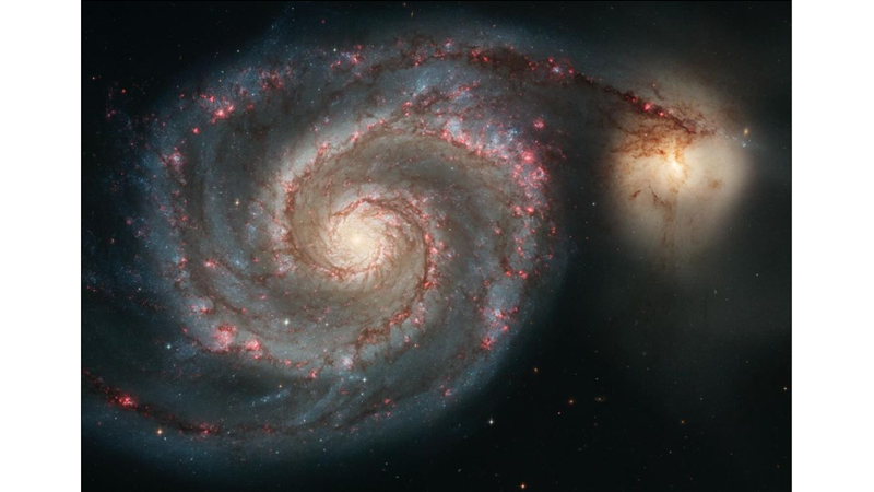 TWO GALAXIES MERGING INTO EACH OTHER