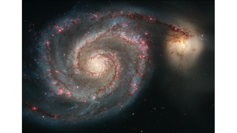 TWO GALAXIES MERGING INTO EACH OTHER